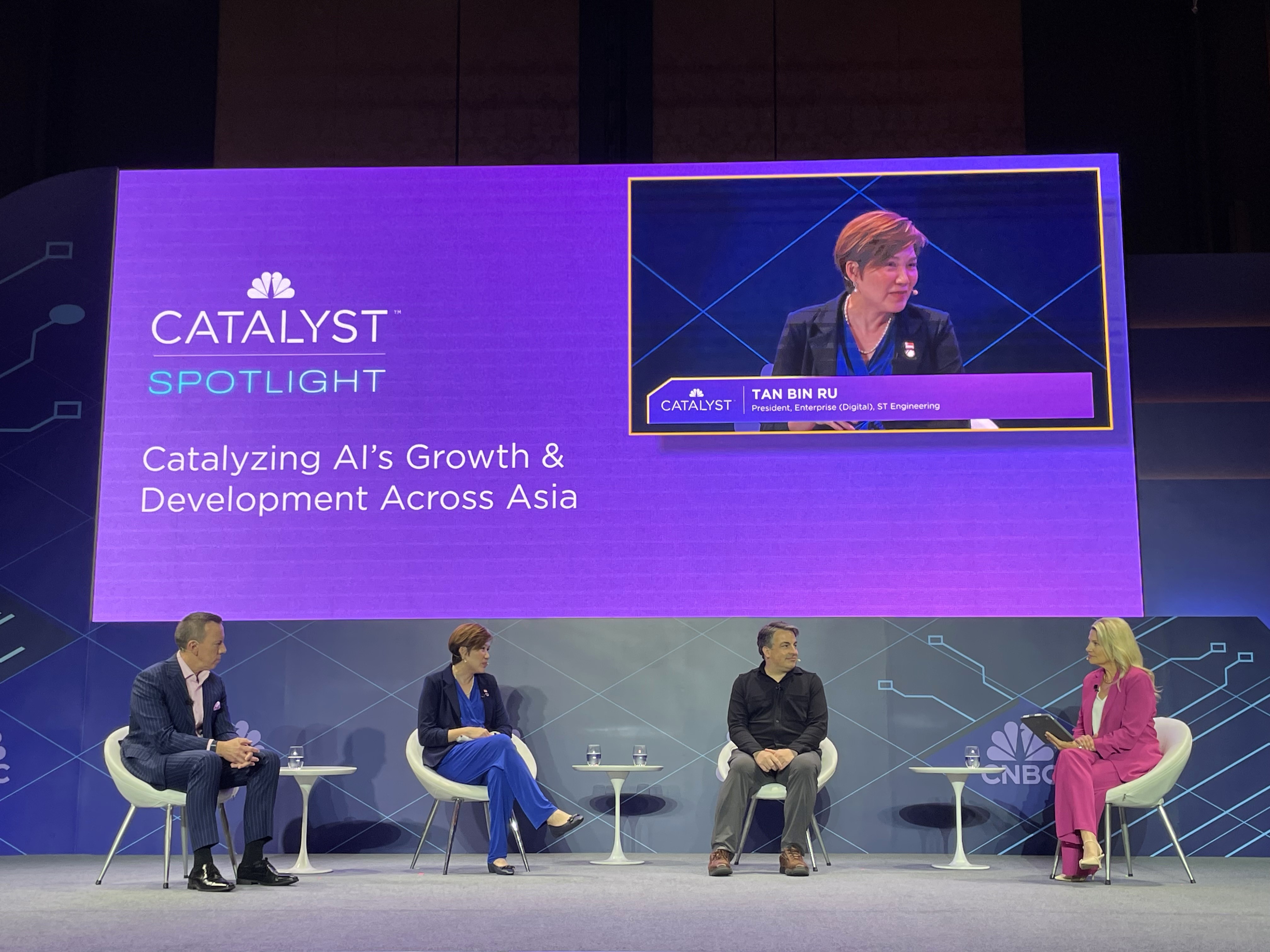 four panelists on stage