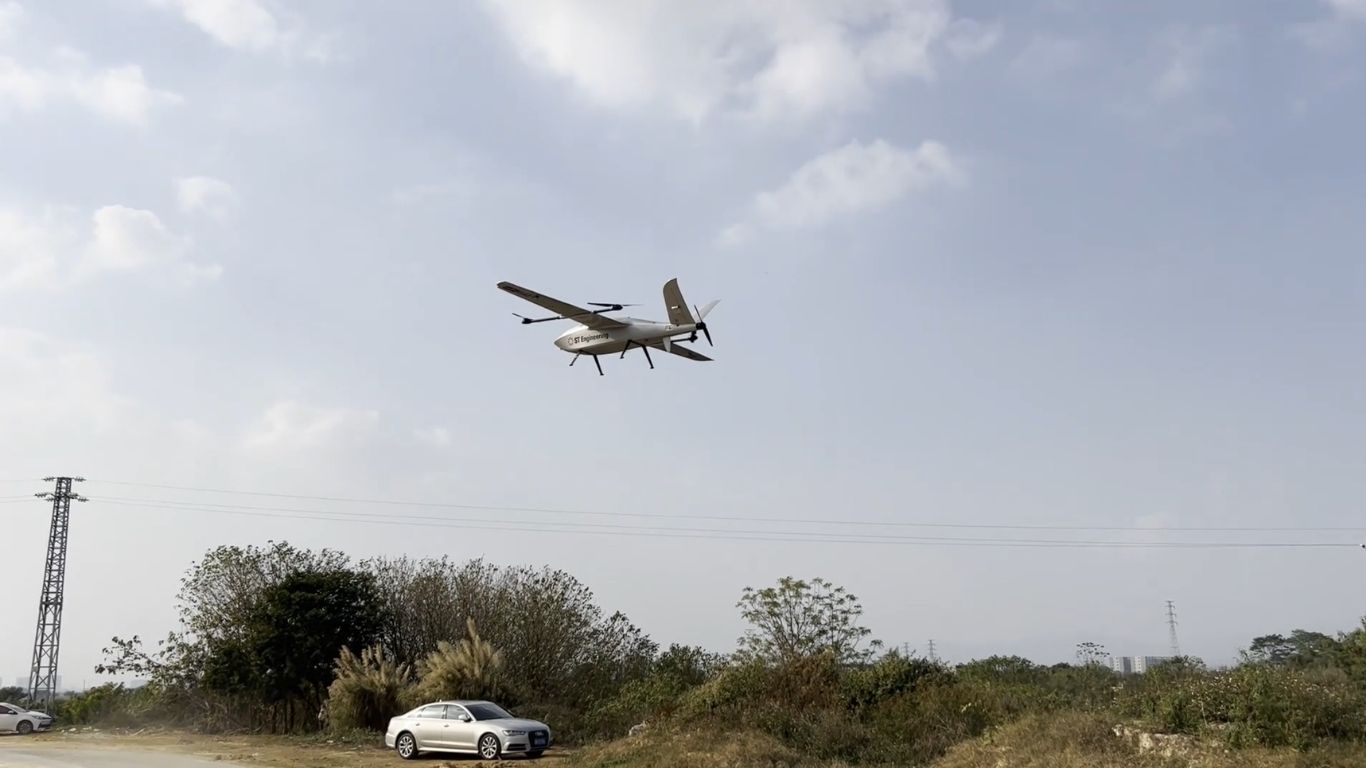Autonomous drone captured against a bright sky