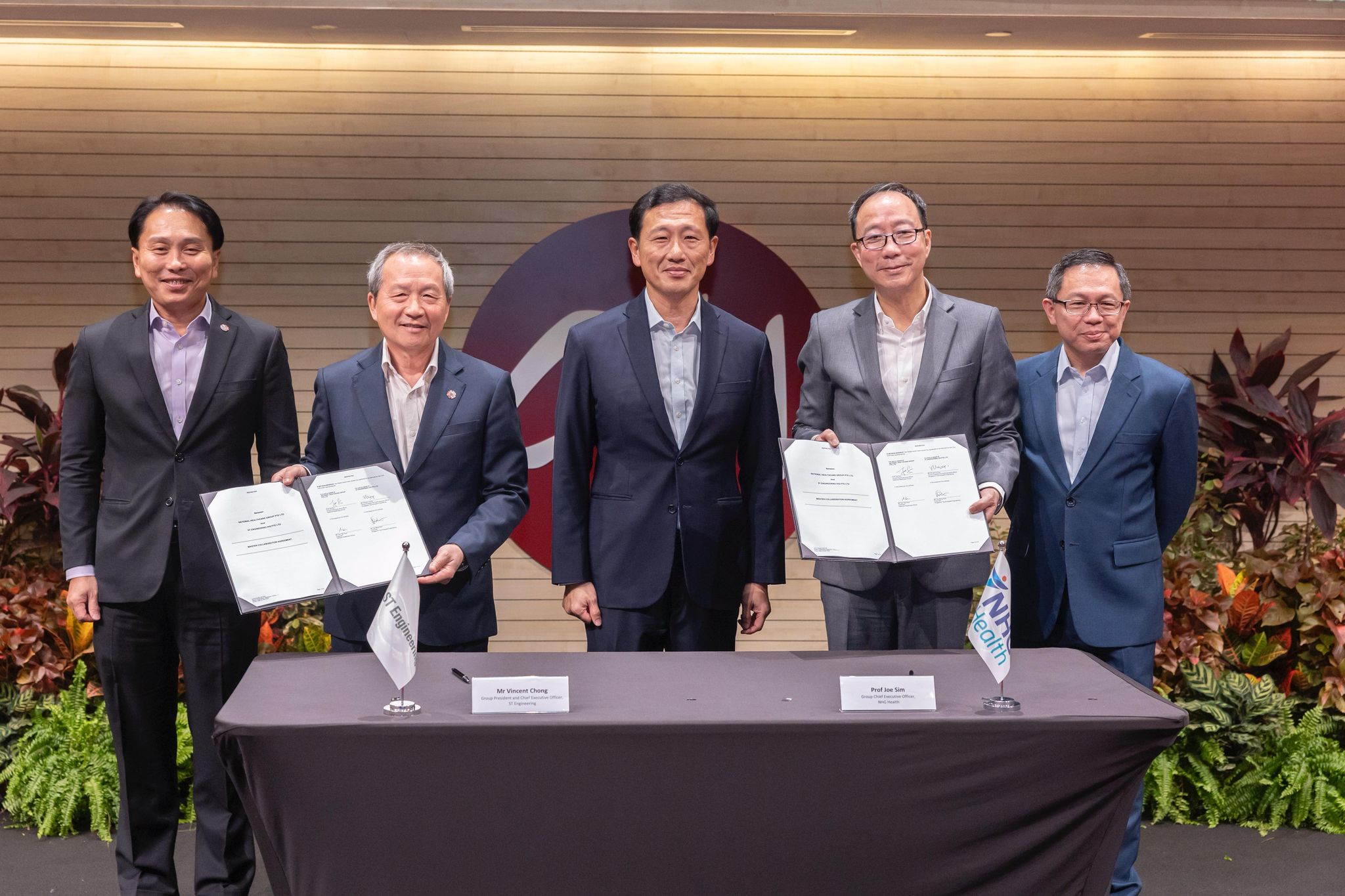 Group photo with signed agreement